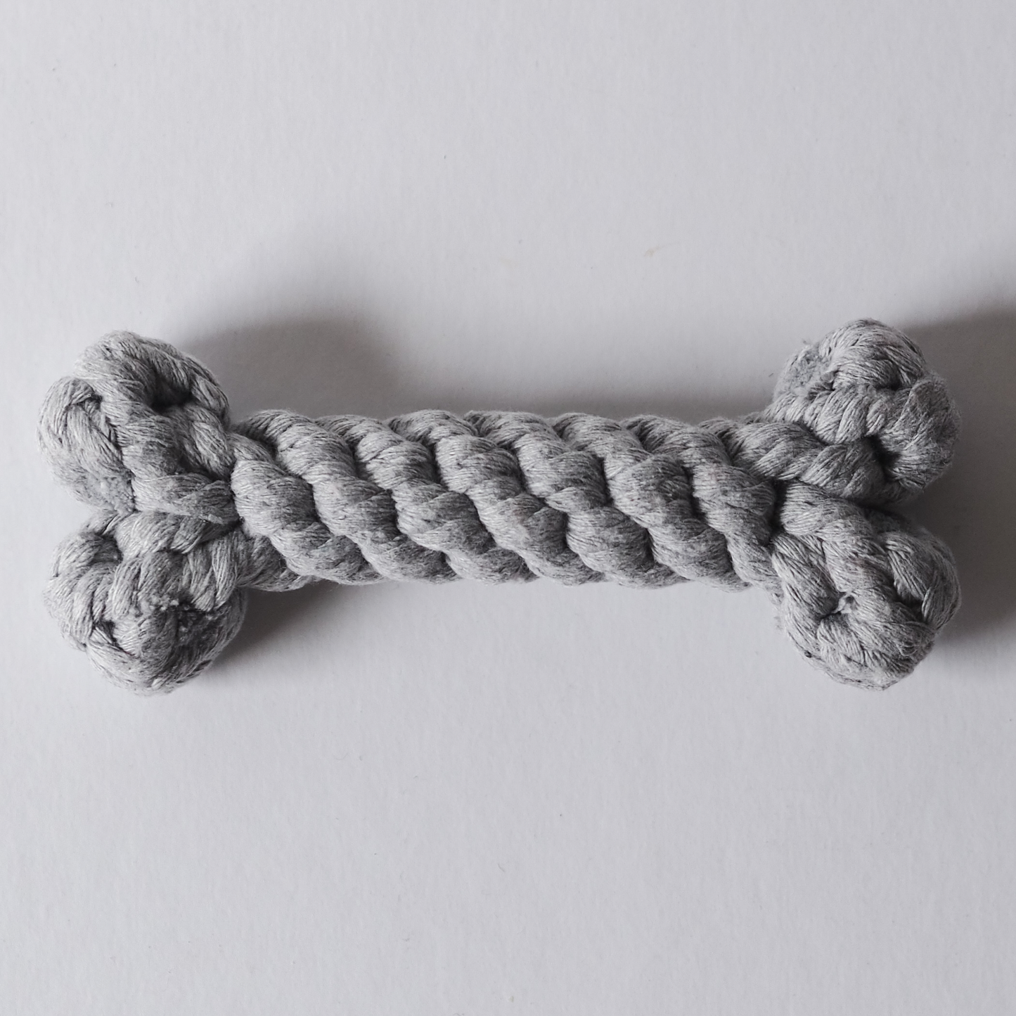 Grey, bone shaped rope toy