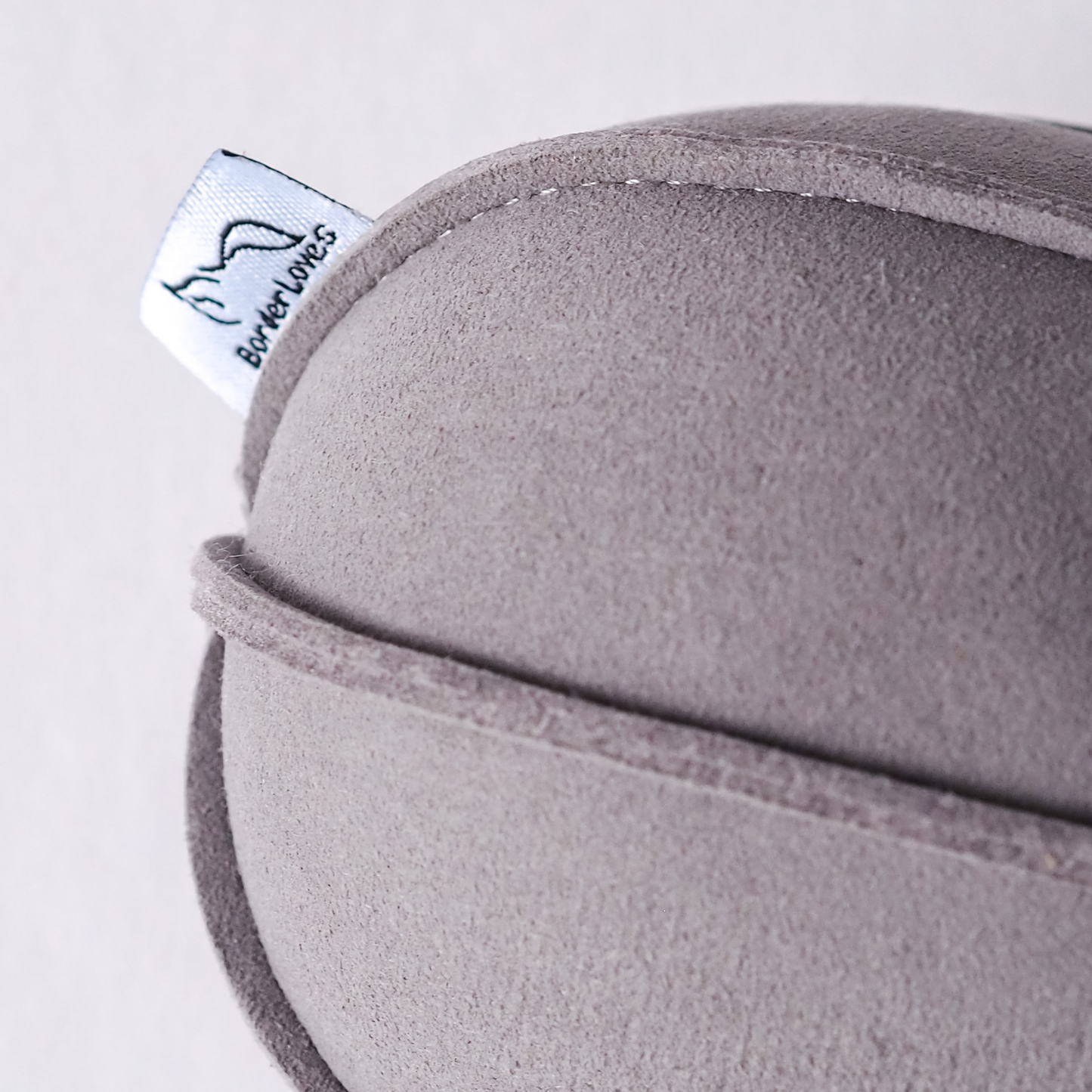Close up of logo label on side of Grey Indoor Suede Ball